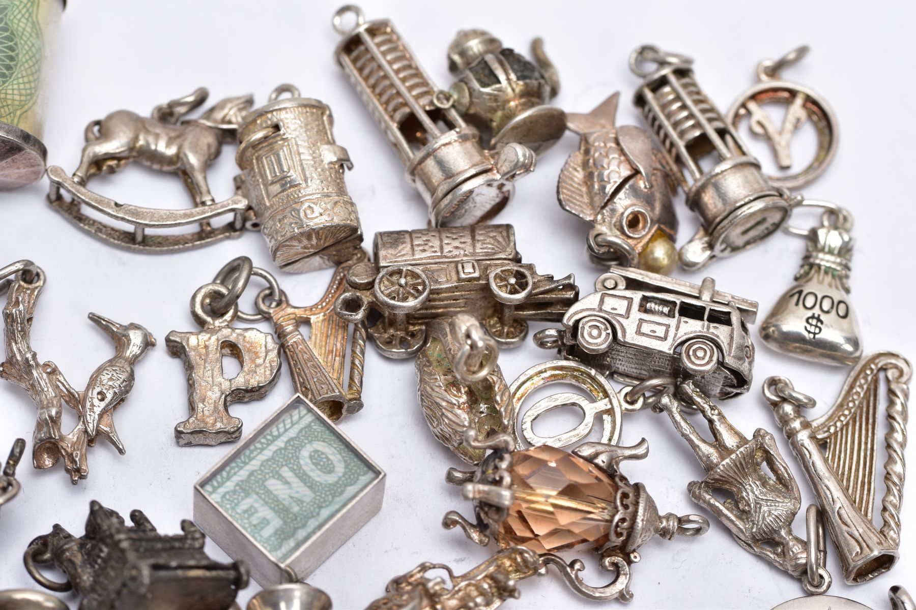 A QUANTITY OF SILVER AND WHITE METAL CHARMS, to include fifty six charms in various forms such as - Image 6 of 7