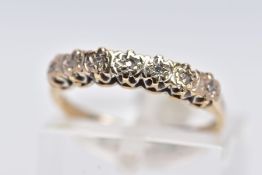 A 9CT GOLD HALF ETERNITY RING, designed with a row of illusion set single cut diamonds, total