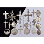 A BAG OF ASSORTED SILVER AND WHITE METAL PENDANTS, to include two silver crosses with hallmarks