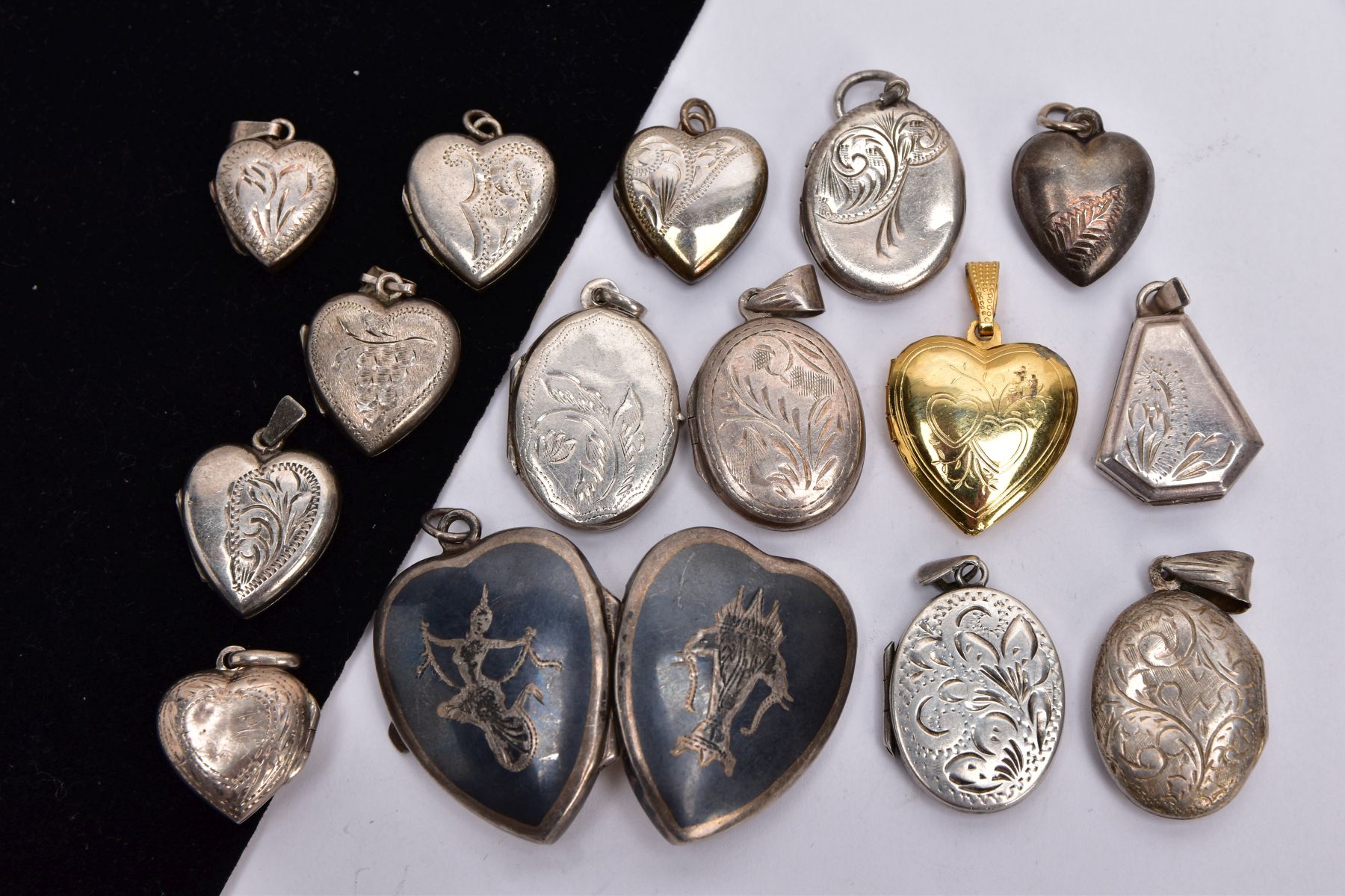 A BAG OF ASSORTED LOCKETS, with various engraved designs and shapes such as five ovals, seven