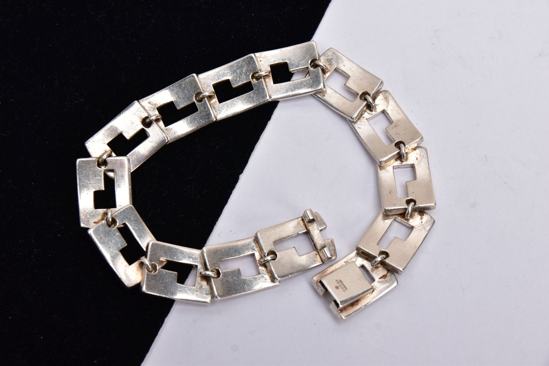 A SILVER 'GUCCI' LINE BRACELET, of an articulated design fitted with fourteen openwork rectangular - Image 2 of 2