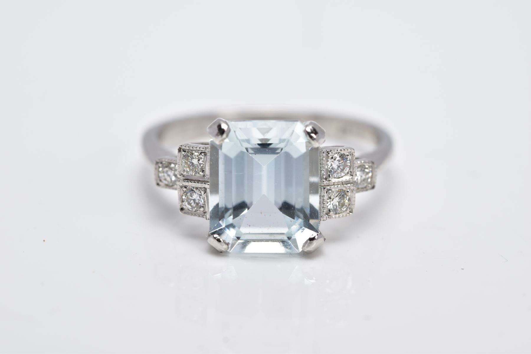 A WHITE METAL AQUAMARINE AND DIAMOND RING, designed with a central claw set, emerald cut aquamarine, - Image 4 of 4