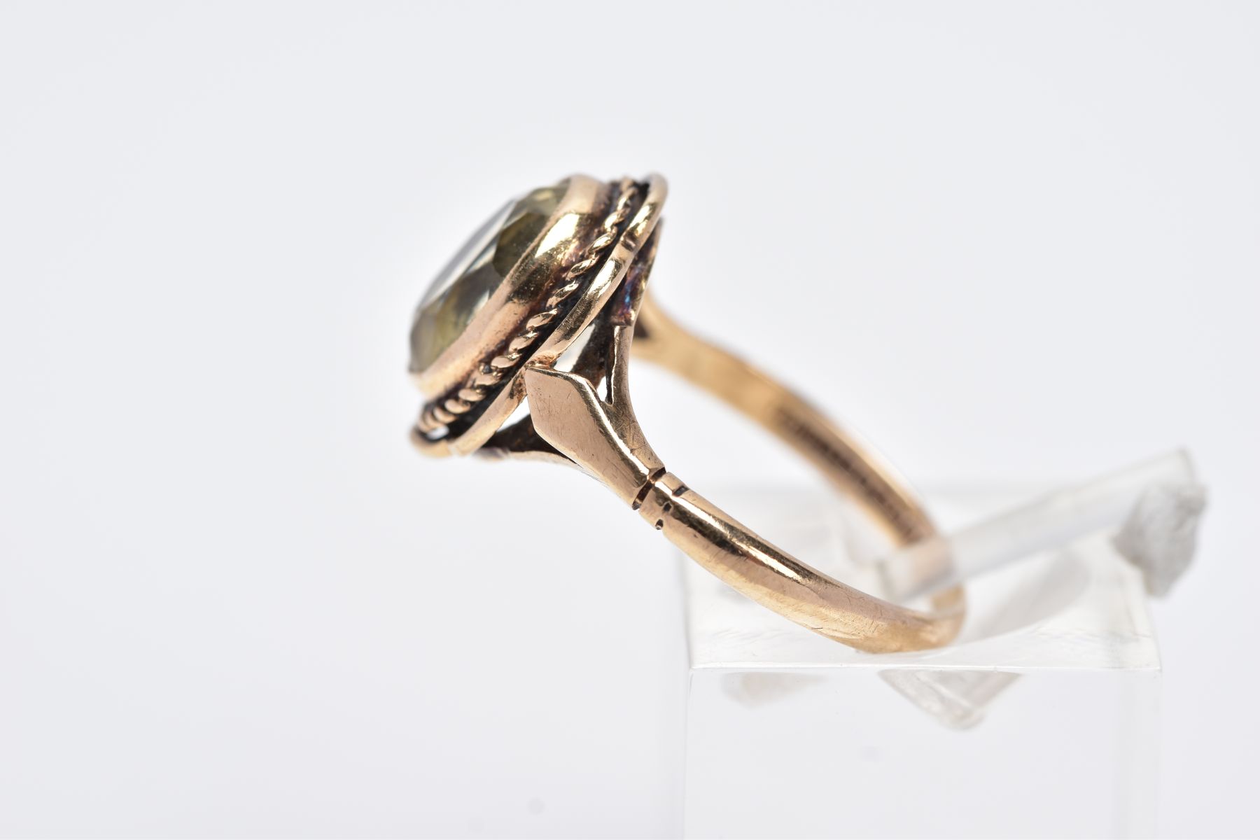 A 9CT GOLD CITRINE RING, designed with a central oval cut citrine within a collet mount, rope - Image 2 of 3