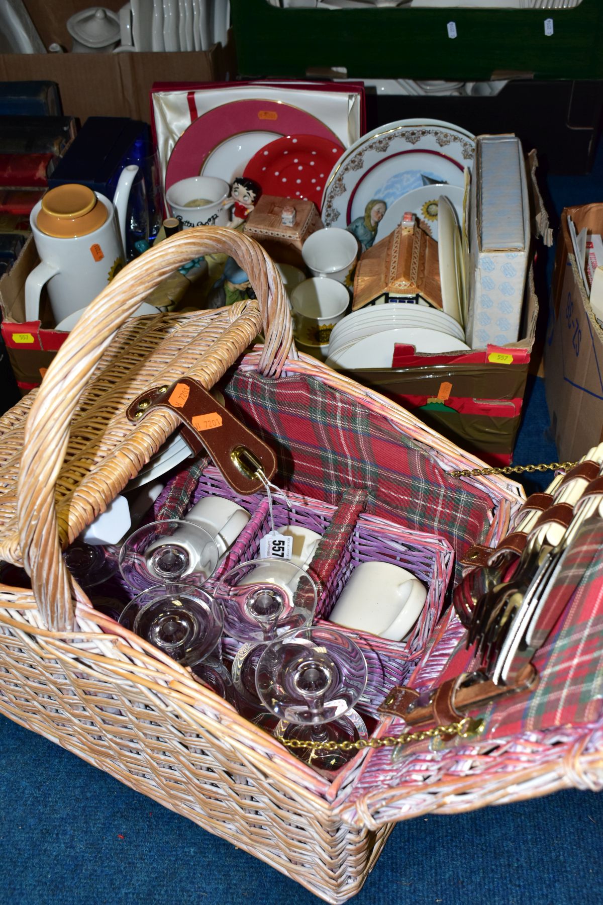 A MODERN WICKER PICNIC BASKET, containing four place settings with two extra wine glasses,