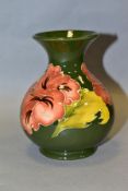 A MOORCROFT POTTERY BULBOUS VASE, coral 'Hibiscus' pattern to green ground, impressed backstamp,