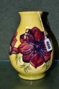 A MOORCROFT ANEMONE PATTERN SQUAT BALUSTER VASE, red/blue flowers on a yellow ground, painted and