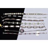 A BAG OF ASSORTED SILVER AND WHITE METAL BRACELETS, to include a cubic zirconia set silver line