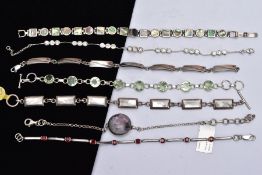 A BAG OF ASSORTED SILVER AND WHITE METAL BRACELETS, to include a cubic zirconia set silver line