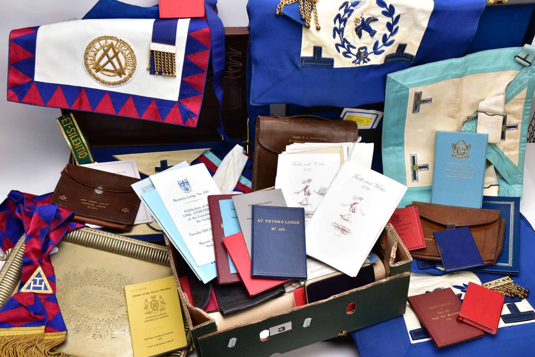 TWO CASES AND A BOX OF MASONIC REGALIA, to include a brown case which opens to reveal a blue and