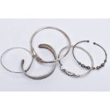A BAG OF ASSORTED SILVER AND WHITE METAL BANGLES, to include three silver bangles such as a mother