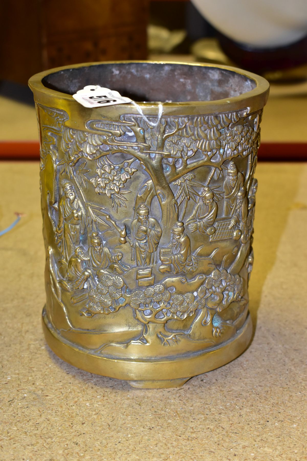 A BRASS ORIENTAL BRUSH POT, height 17cm