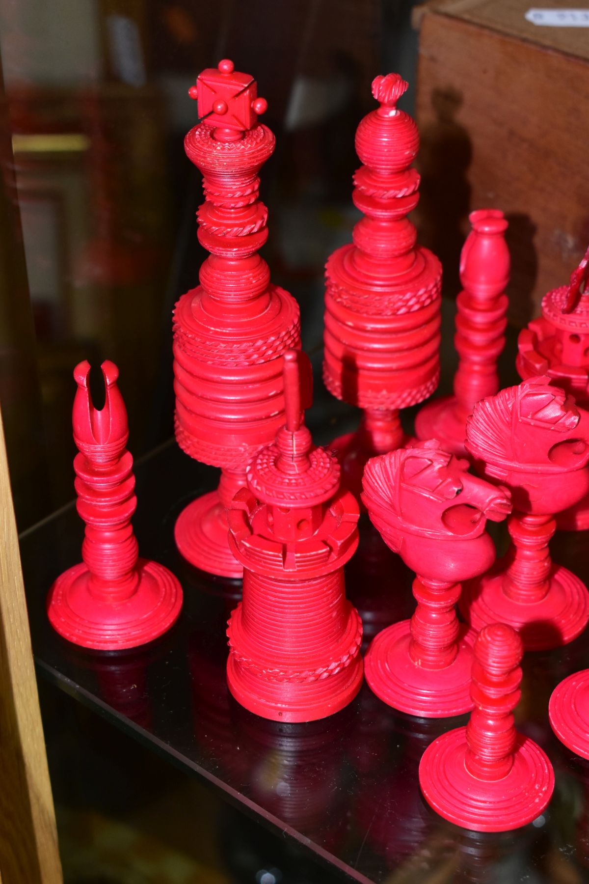 A 19TH CENTURY CARVED BONE SET OF CHESS PIECES, one half stained red, height king 14cm, with a baise - Image 3 of 7