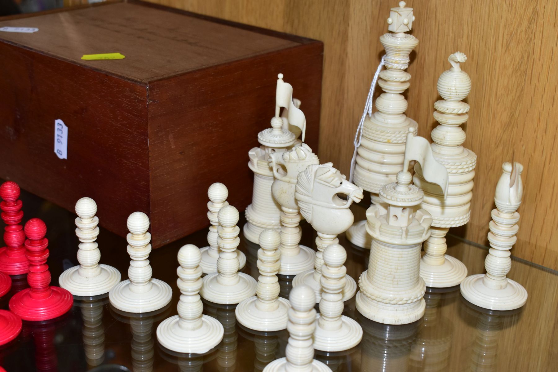 A 19TH CENTURY CARVED BONE SET OF CHESS PIECES, one half stained red, height king 14cm, with a baise - Image 5 of 7