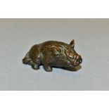 A 20TH CENTURY SMALL BRONZE FIGURE OF A SEATED HOG, unmarked, height 2.2cm x length 5.1cm