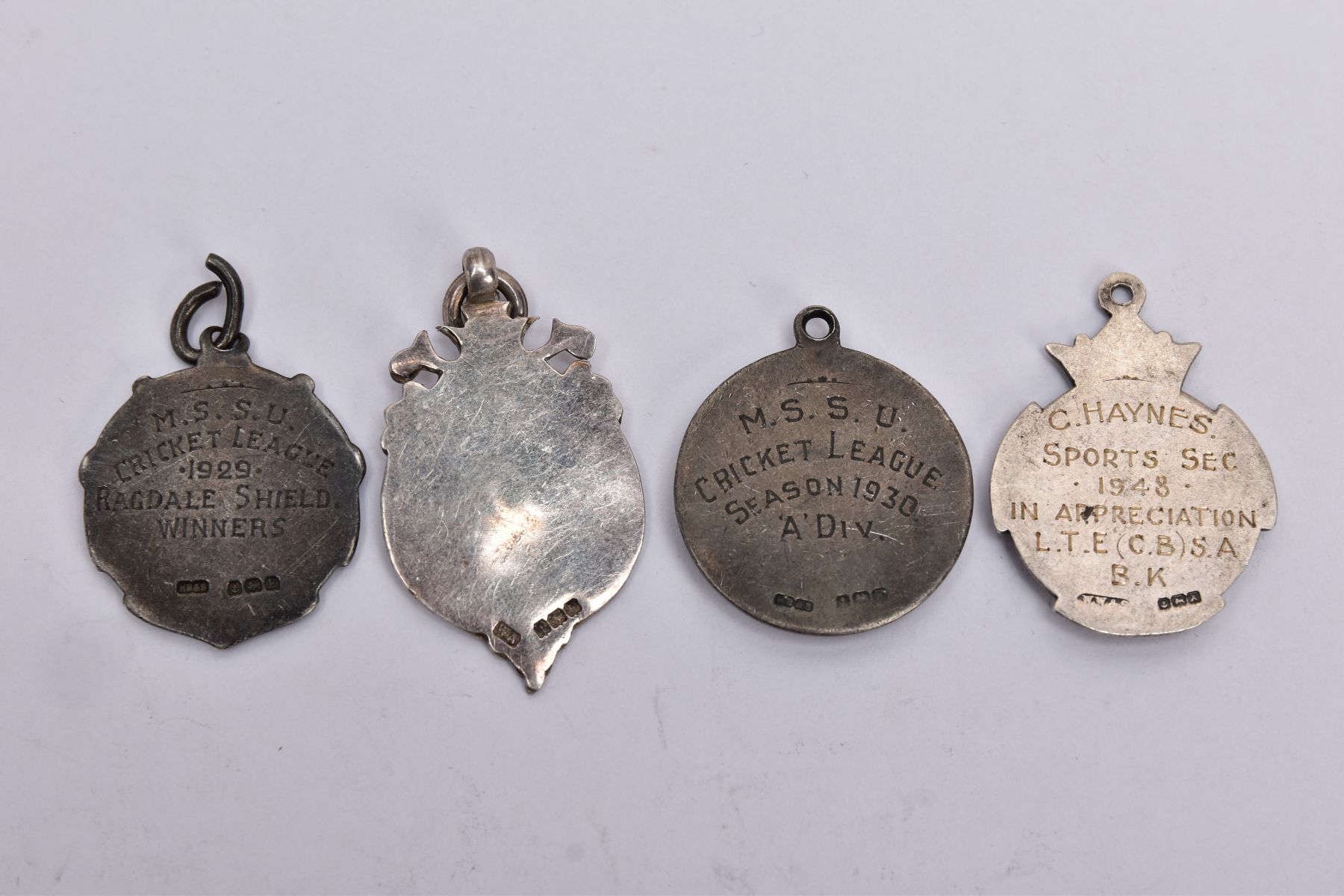 FOUR SILVER MEDAL FOBS, each of a circular form with vacant cartouches, two engraved to the - Bild 2 aus 2