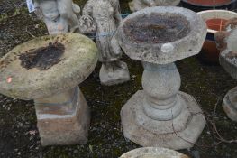 A COMPOSE OCTAGONAL BIRD BATH on a shaped circular base and a stepped base diameter of top 36cm x