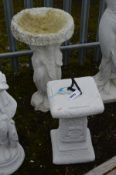 A WHITE PAINTED COMPOSITE BIRD BATH, on a separate base with semi clad classical ladies, diameter