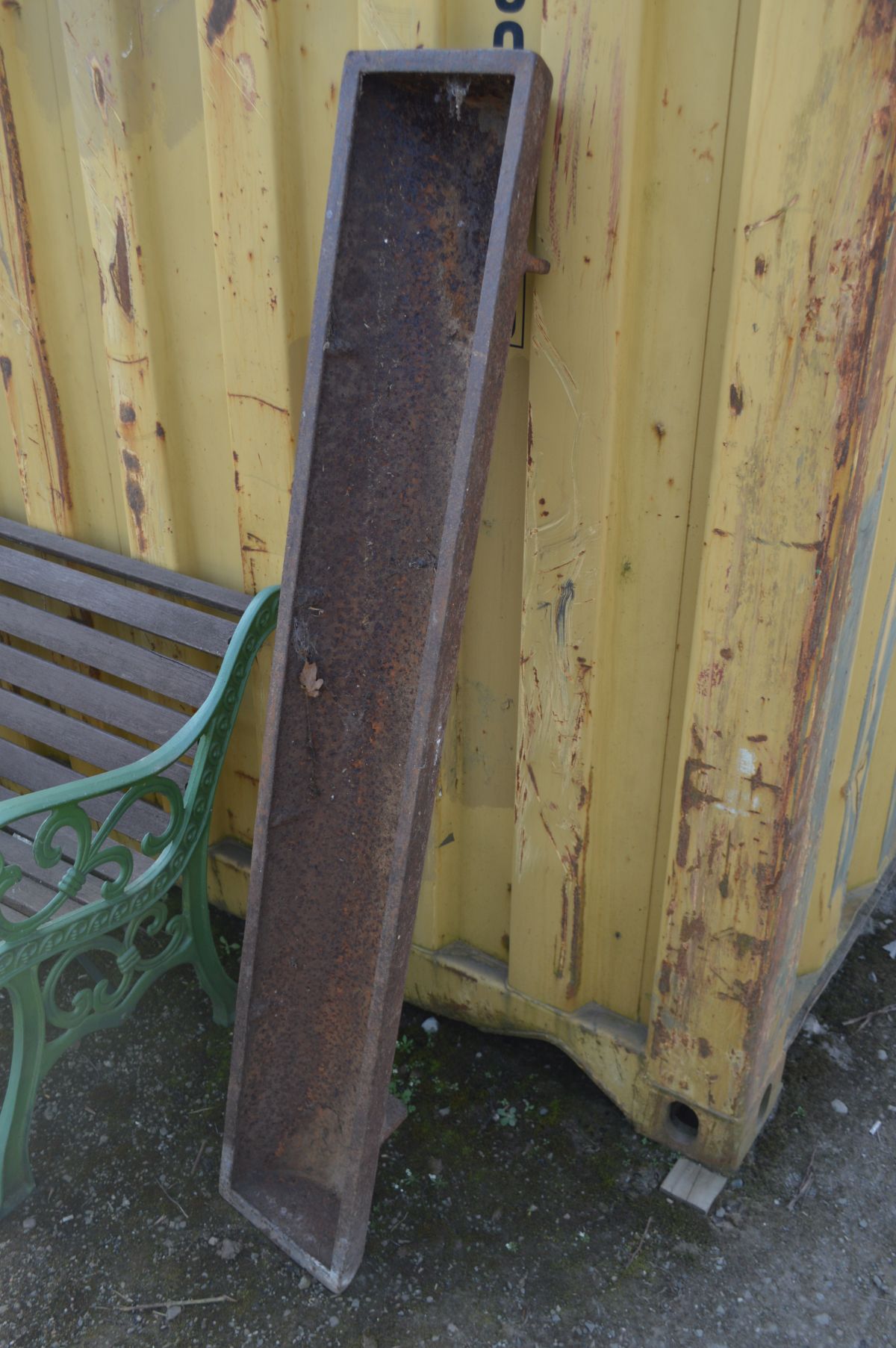 A LONG CAST IRON PIG FEEDER, length 153cm