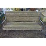 A WROUGHT IRON AND TEAK SLATTED GARDEN BENCH, width 148cm