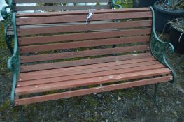 `A GREEN PAINTED METAL AND TEAK SLATTED GARDEN BENCH, width 125cm