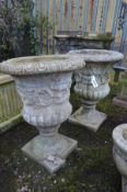 A PAIR OF COMPOSITE CAMPANA URNS, on a separate square base, diameter 44cm x height 63cm (Sd to base