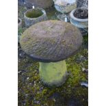 A SANDSTONE STADDLE STONE on circular bases, diameter 61cm x height 74cm (possibly a pair to lot