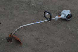 A STIHL FS40 PETROL STRIMMER (pulls freely and runs)