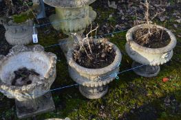 A PAIR OF COMPOSITE CIRCULAR GARDEN URNS on a separate base, diameter 41cm x height 37cm along