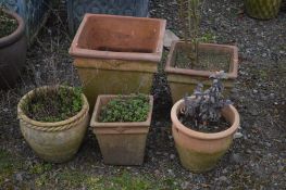 FIVE VARIOUS TERRACOTTA PLANTERS, to include a two sized square tapered planters, and three other