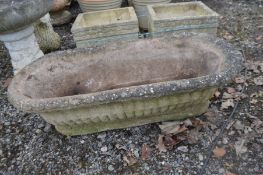 A COMPOSITE OBLONG CAMPANA GARDEN PLANTER with rounded ends, length 88cm x depth 39cm x height 30cm