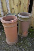 A PAIR OF TERRACOTTA CYLINDRICAL CHIMNEY POTS, diameter 31cm x height 59cm and another chimney