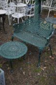 A GREEN PAINTED ALUMINIUM GARDEN BENCH with arched lattice work back to armrests, width 95cm and a