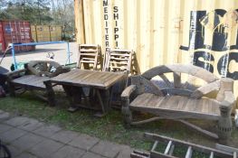 A THREE PIECE WOODEN GARDEN SET, the upright supports made out of Vietnamese Ox cart axles, with