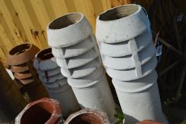 TWO PAIRS OF TERRACOTTA LOUVRED CHIMNEY POT, three painted in white, larger pots height 94cm,