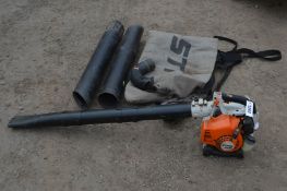 A STIHL SH 75 PETROL BLOWER (pulls freely and runs) along with two Stihl garden vac bags, a