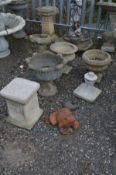 THREE VARIOUS COMPOSITE GARDEN PLANTERS of various shapes, a small bird bath, pillar, garden urn