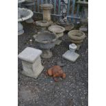 THREE VARIOUS COMPOSITE GARDEN PLANTERS of various shapes, a small bird bath, pillar, garden urn