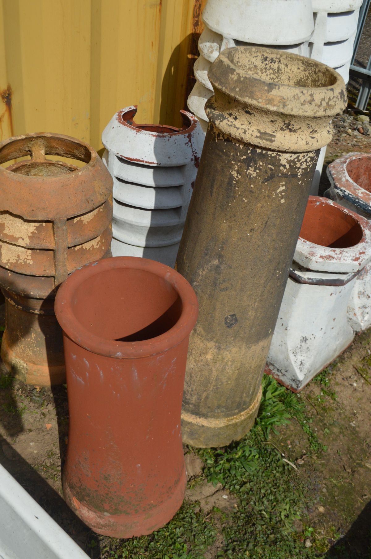 THREE OCTAGONAL TOPPED TERRACOTTA CHIMNEY POTS, two pots painted white, and two cylindrical - Image 3 of 3