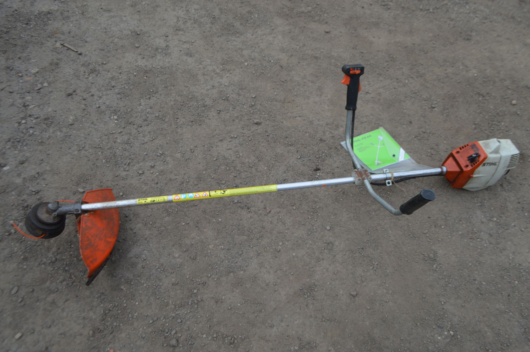 A STIHL FS 44 PERTOL STRIMMER, with manual (pulls freely and starts)