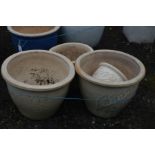 FIVE SIMILAR CREAM GLAZED PLANT POTS, of various sizes, largest diameter 38cm x height 31cm