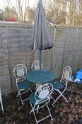 A WHITE AND GREEN PAINTED WROUGHT IRON CIRCULAR GARDEN TABLE, with tile inserts, diameter 40cm x