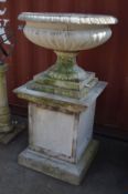 A LARGE RECONSTITUTED STONE CAMPANA GARDEN URN, on a separate square plinth base, diameter 89cm x