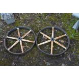 A PAIR OF VINTAGE CAST IRON CART WHEELS, diameter 62cm