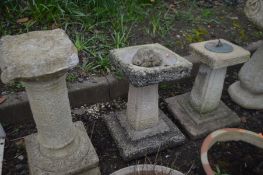 A RECONSTITUTED STONE SUN DIAL on square stepped base, height 47cm, and a matching bird bath,