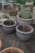 A LARGE COMPOSITE CIRCULAR GARDEN PLANT POT, diameter 58cm x height 45cm and a matching pair of