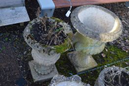 A COMPOSITE CAMPANA GARDEN URN, diameter 50cm x 66cm along with a smaller composite campana garden