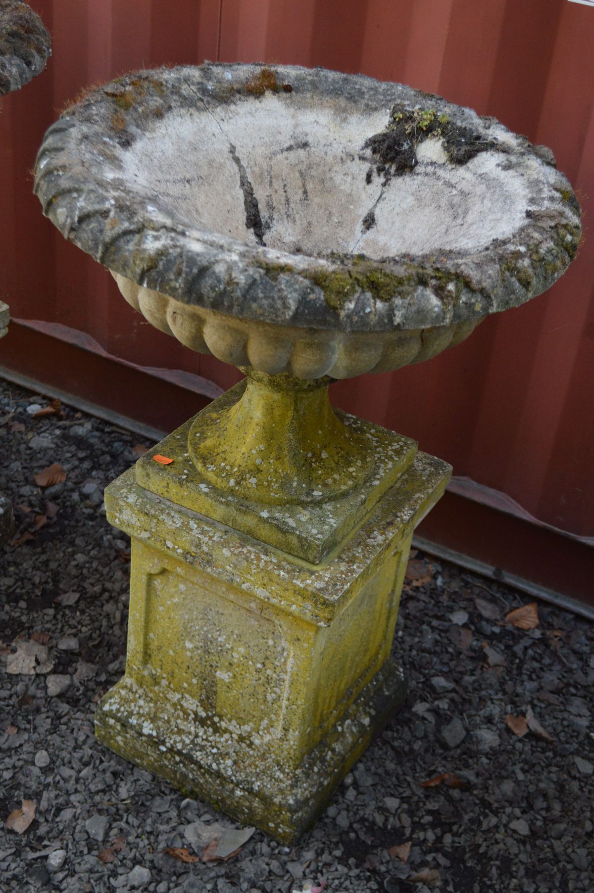 A PAIR OF WEATHERED RECONSTITUTED STONE CAMPANA GARDEN URNS on a separate square plinth base, - Image 2 of 2