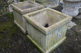 A PAIR OF COMPOSITE SQUARE AND REEDED GARDEN PLANTERS, 46cm squared x height 43cm