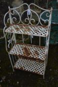 A WROUGHT IRON FOLDING THREE TIER GARDEN STAND, with foliate and lattice detail, width 62cm x