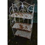 A WROUGHT IRON FOLDING THREE TIER GARDEN STAND, with foliate and lattice detail, width 62cm x